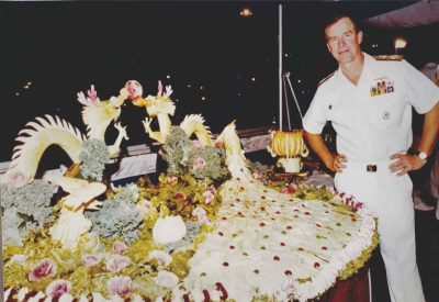 P7: Admiral Thomas B. Fargo, 29th Commander in Chief of the U.S. Pacific Fleet, with the performed dishes on display.